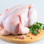 Raw,Chicken,Carcass,On,The,Cutting,Board,Isolated,On,White